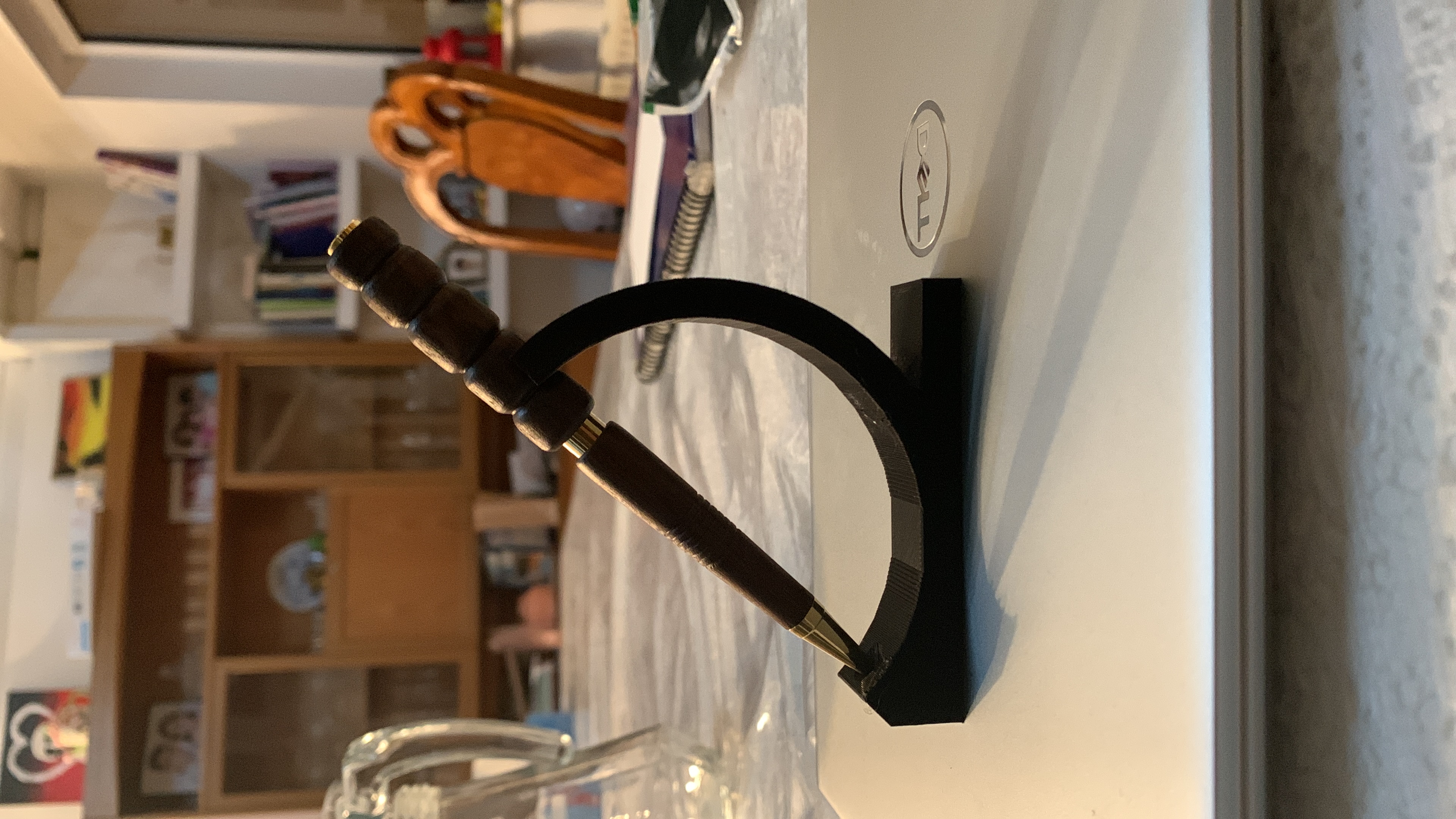 Handmade wooden pen on a display stand